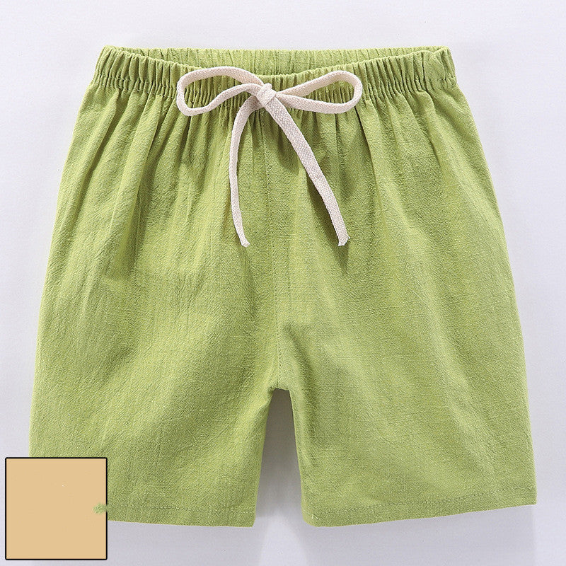 Children's cotton shorts in light blue, yellow, and orange for summer outings.