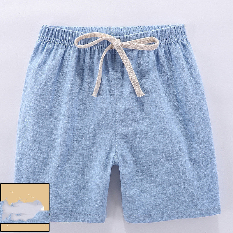Children's cotton shorts in light blue, yellow, and orange for summer outings.