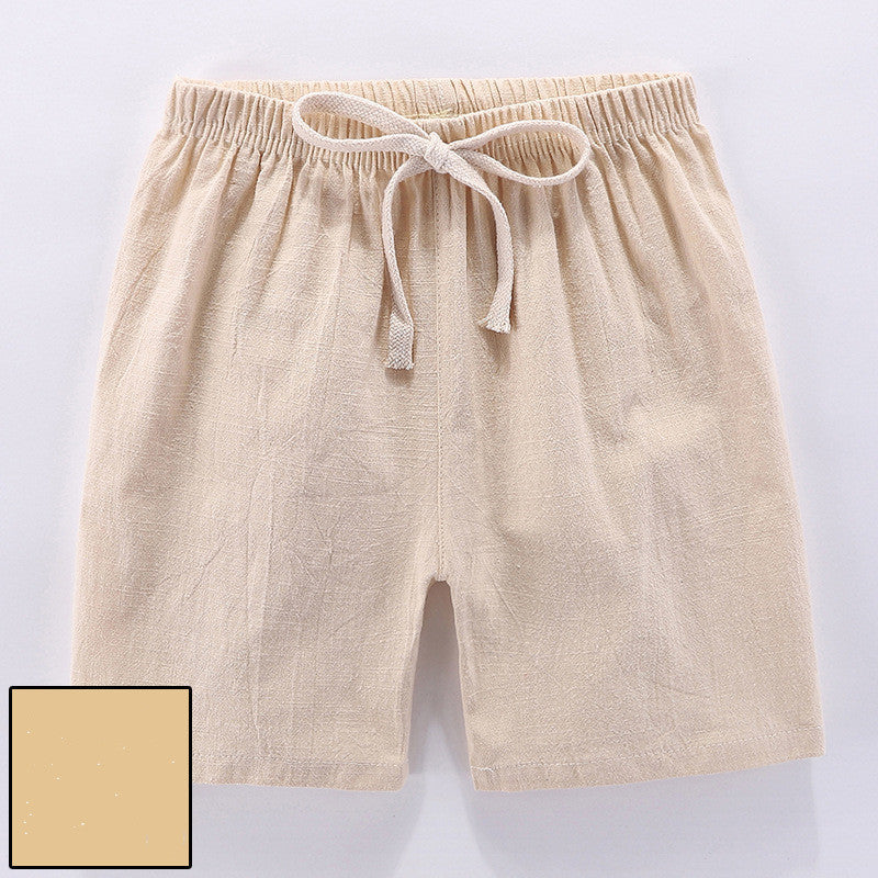 Children's cotton shorts in light blue, yellow, and orange for summer outings.