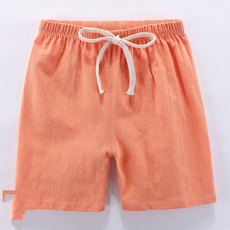 Children's cotton shorts in light blue, yellow, and orange for summer outings.