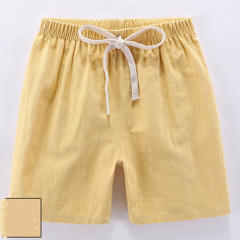 Children's cotton shorts in light blue, yellow, and orange for summer outings.