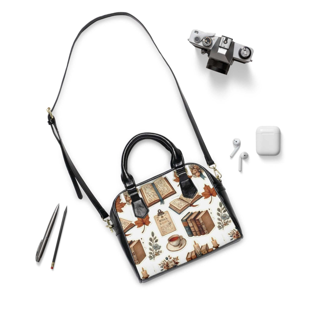 Personalized shoulder handbag with book and coffee print, black handles, removable adjustable strap, and zippered closure